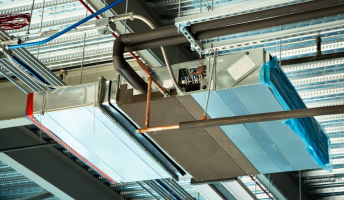 Overhead insulated ductwork, fan-powered box and hydronic runs