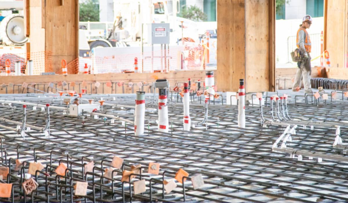 Post-tension deck rebar with plumbing and conduit rough-in penetrations